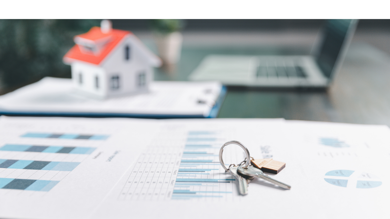 Two professionals discussing real estate documents outdoors in front of modern buildings.